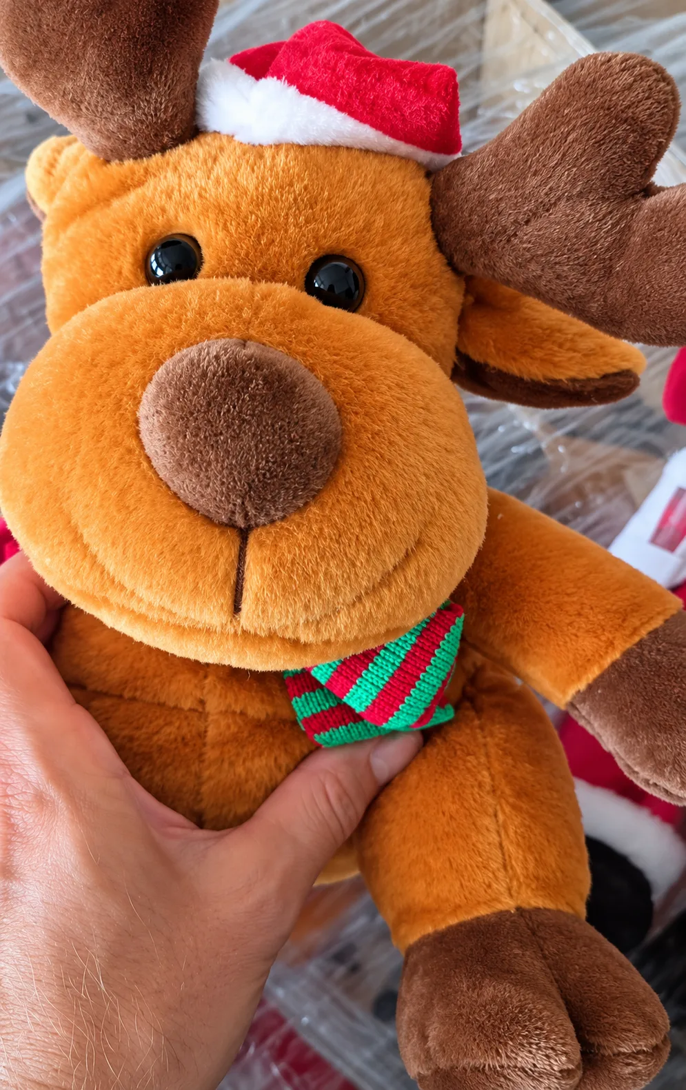 Lot of dancing stuffed Santa Clauses and deers thumbnail
